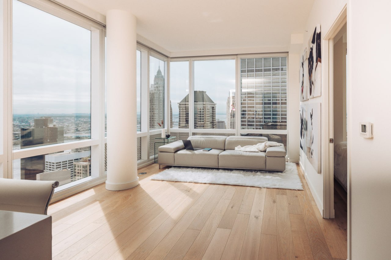 Finished high-rise condominium with light wood flooring