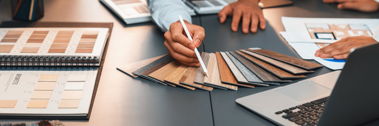 Flooring samples being compared during a project consultation